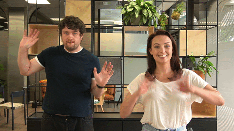 Gif of Eric & Kate doing jazz hands