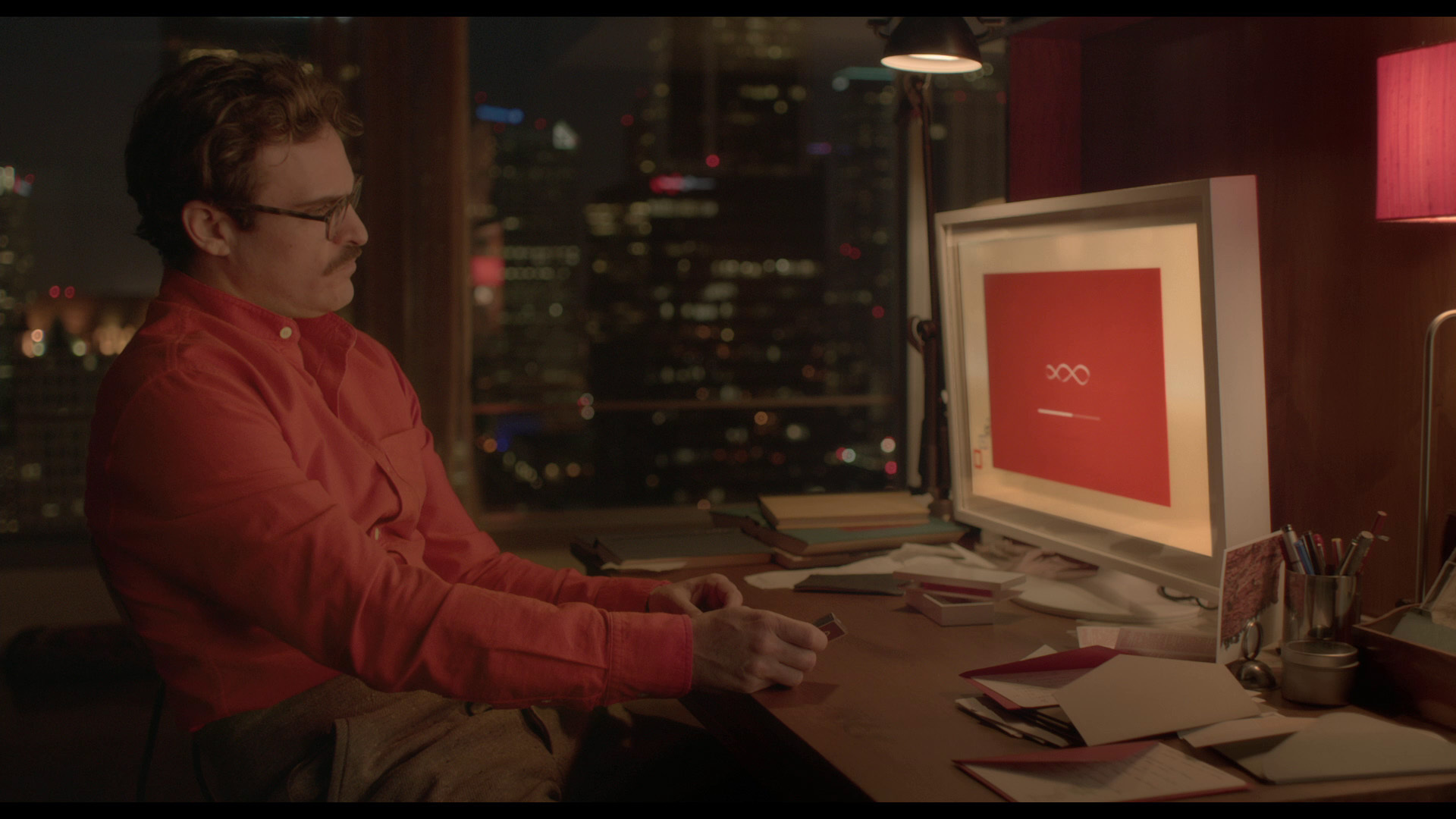 Protagonist of the movie Her, Theodore Twombly, at his desk.